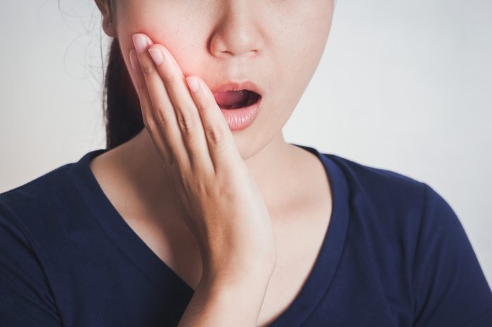 toothache jaw pain asian woman