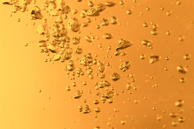 closeup of yellow carbonated water