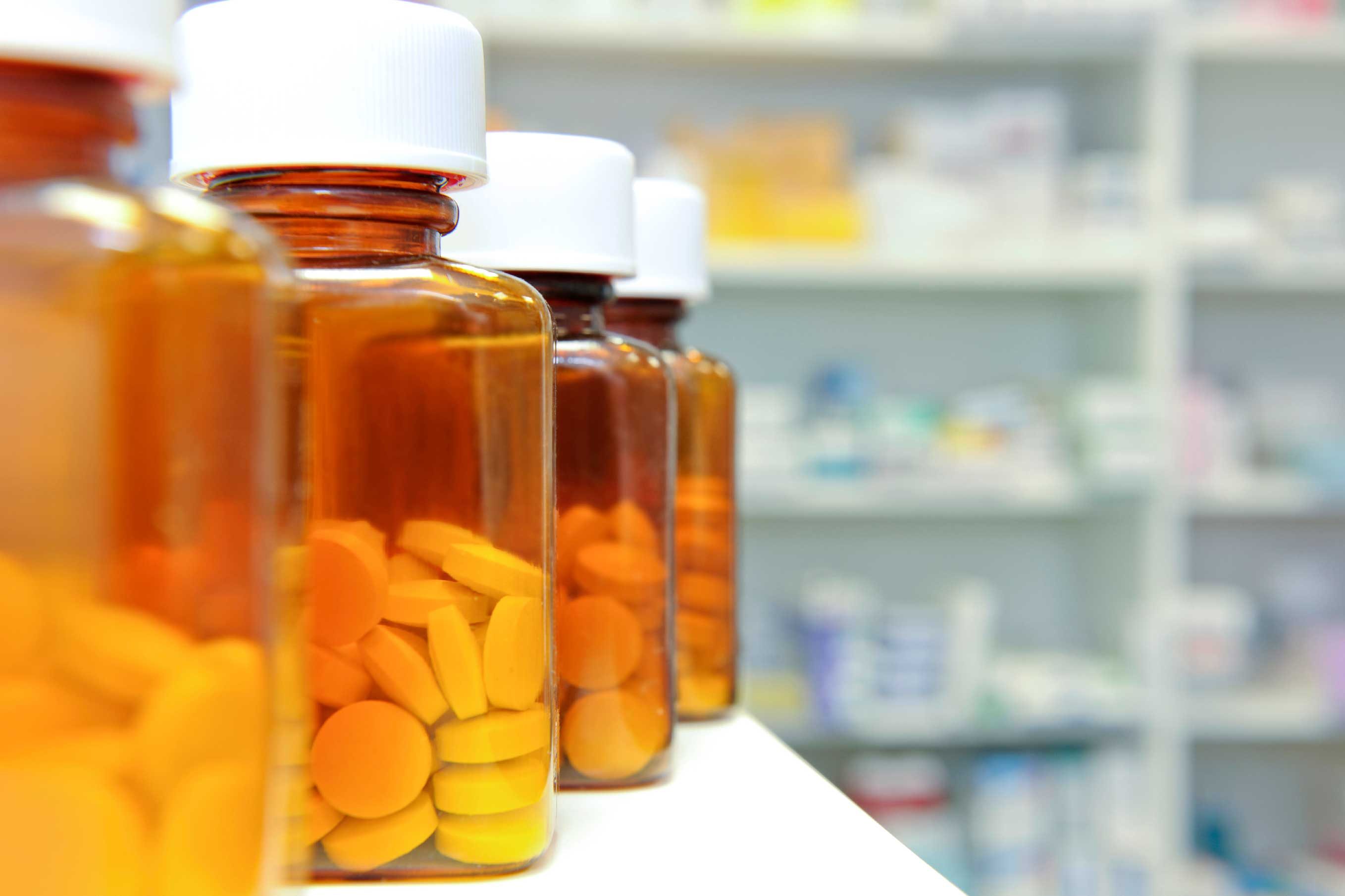 bottles of pills in a pharmacy