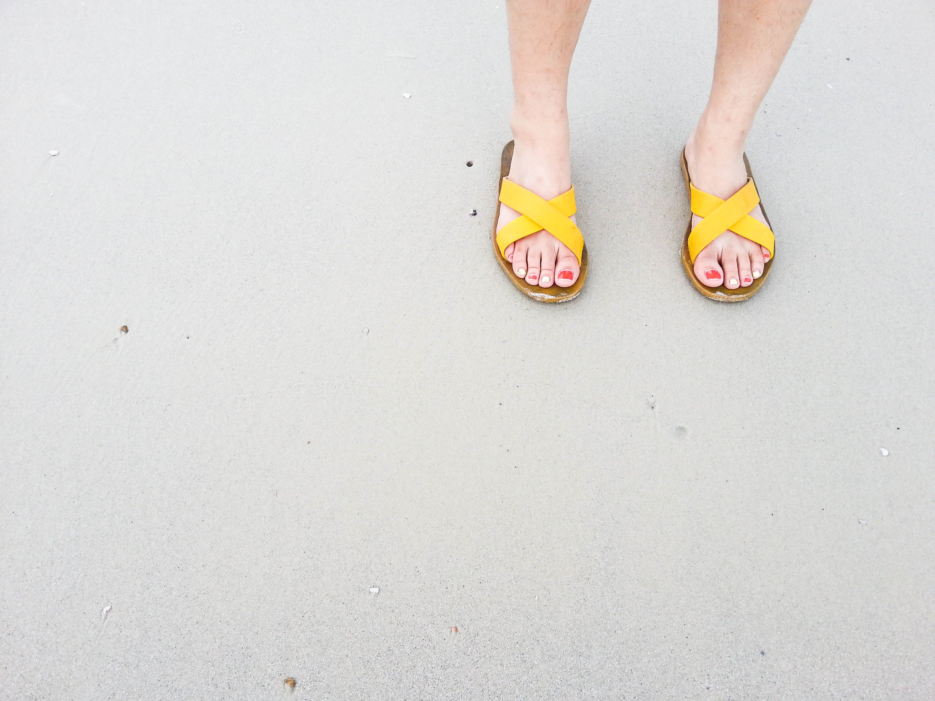 woman wearing yellow sandals