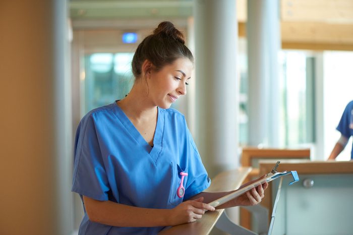 nurse checking patient chart