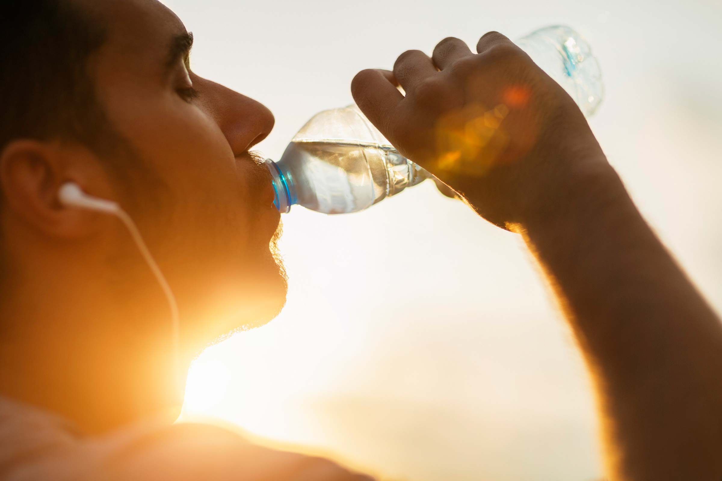 Man sipping from a water bottle.