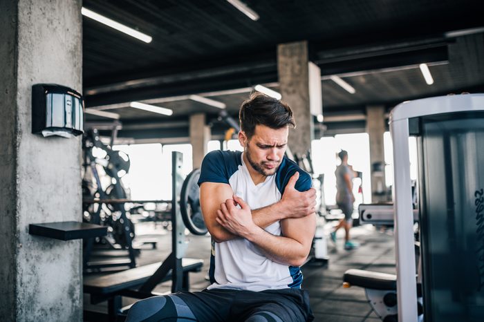 man in pain during workout exercise