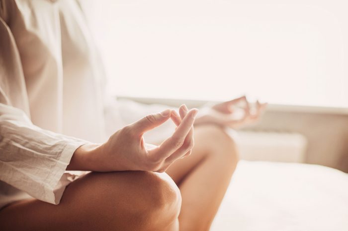 woman holding a meditative pose