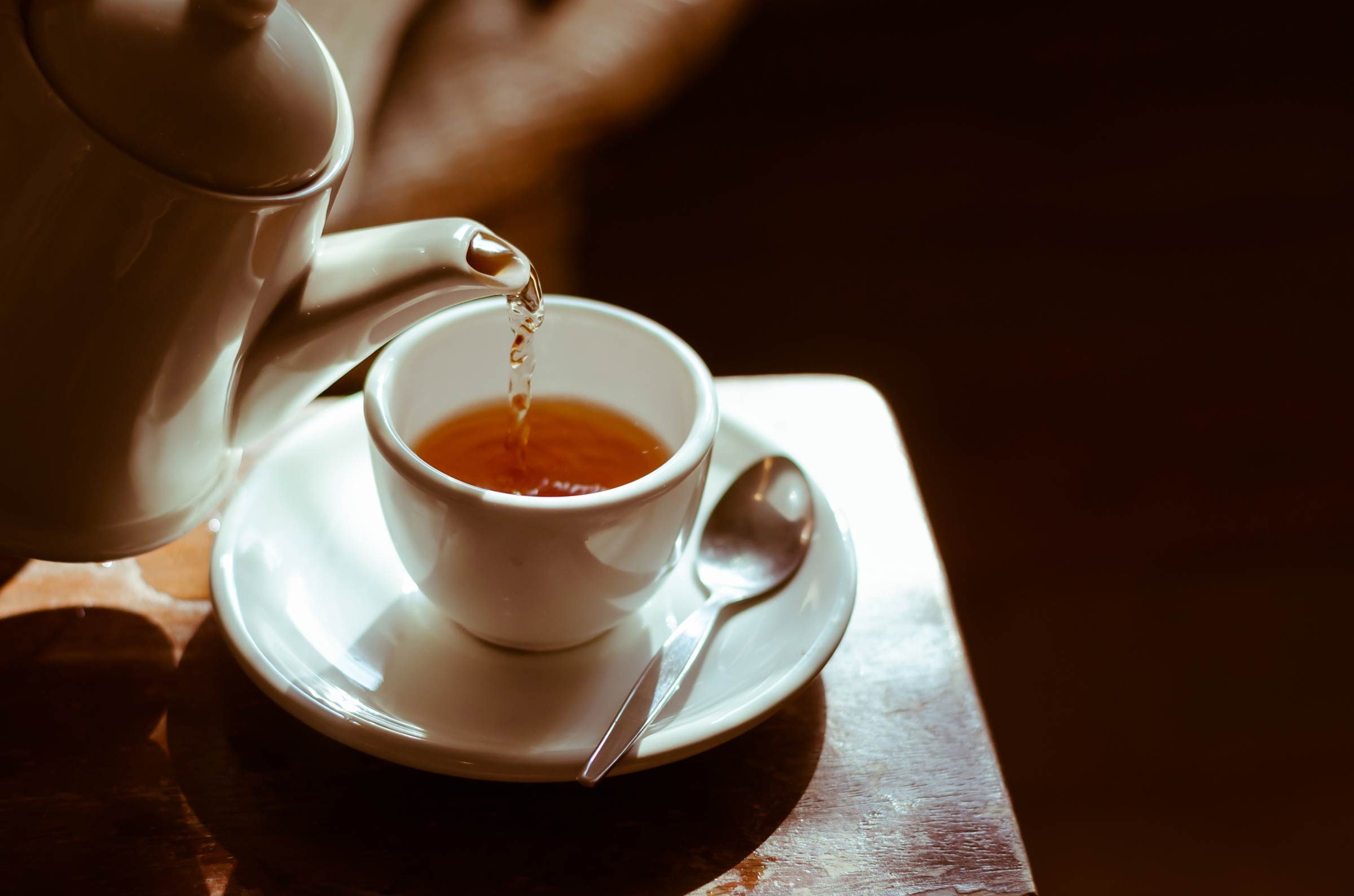 pouring cup of tea