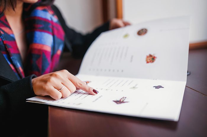 woman reading menu