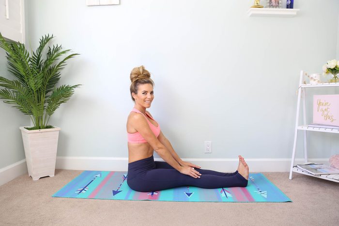 trainer sitting on the floor, legs straight