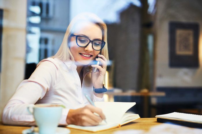 woman in coffee shop on phone