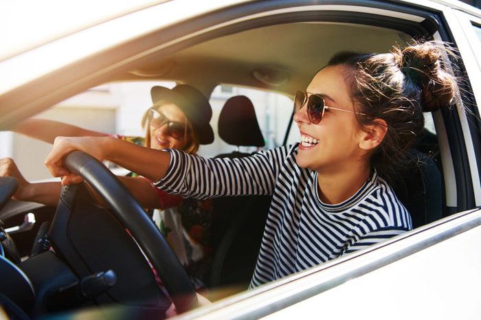 Friends driving in car