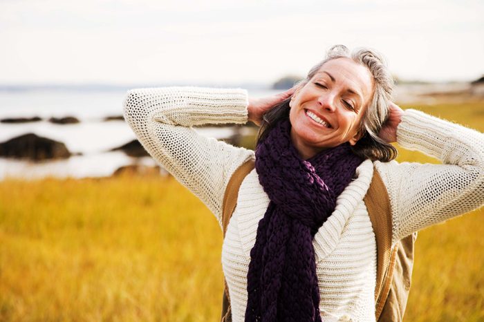 joyful woman outside near water