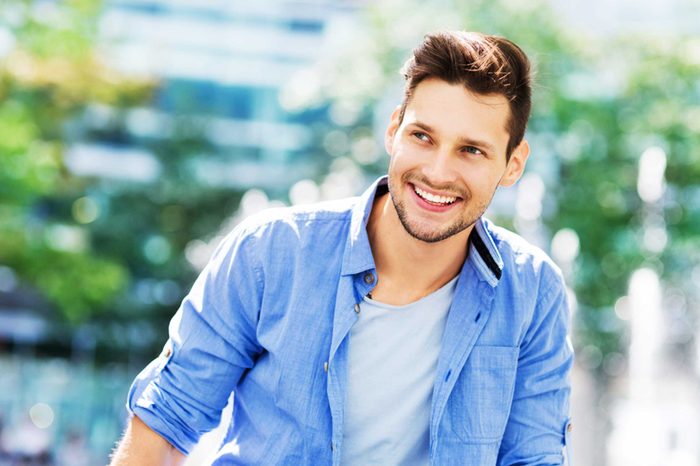 Man in a blue shirt smiling