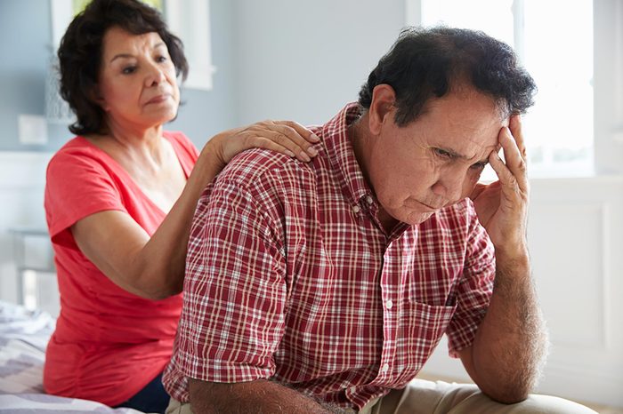 woman comforting worried man 