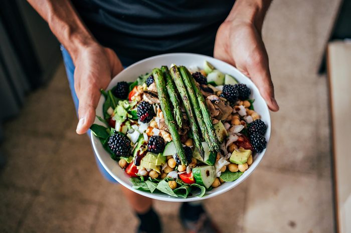 man holding salad