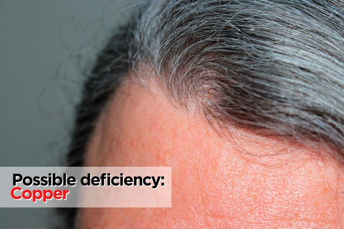 Woman's hair with small amount of gray