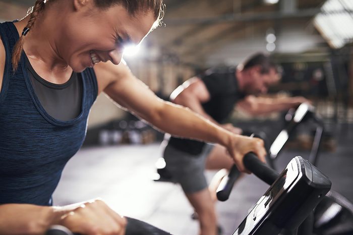 woman straining really hard while exercising