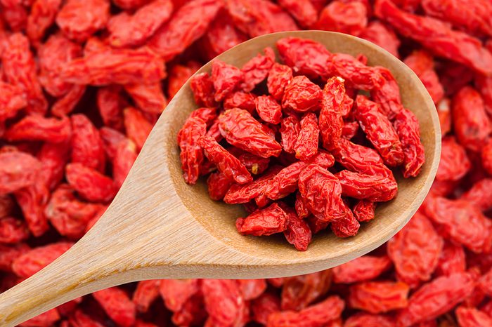 Goji berries on a wooden spoon