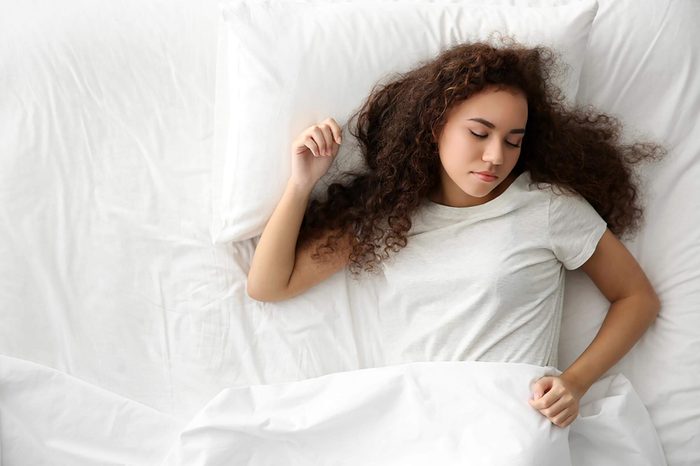 Girl sleeping on her back