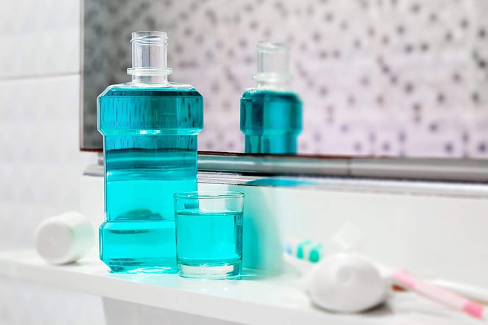 Mouthwash on a bathroom shelf