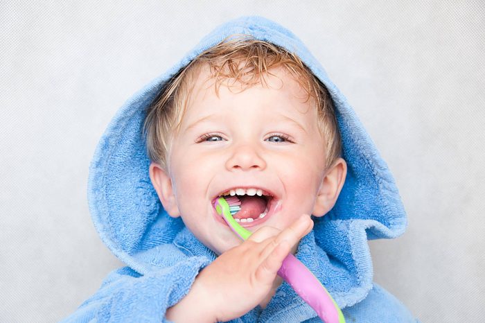 Little boy brushing teeth