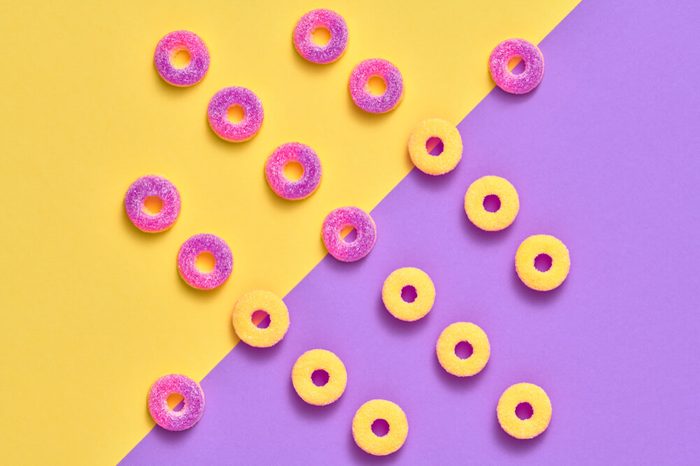 Gummy Candies background, Sweets. Creative Flat lay. Summer Party, Purple Birthday Layout. Bright Colorful. Fun Trendy fashion Style. Minimal. Pop Art