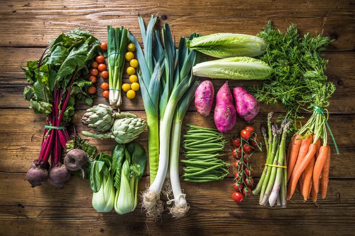 Local market fresh vegetables including beets, carrots, tomatoes, leeks and artichokes