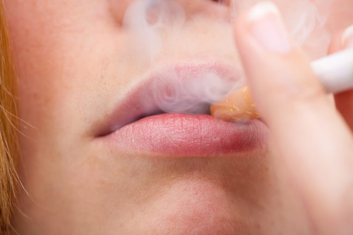 Woman smoking a cigarette.