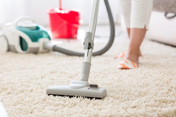 Suction grey carpet cleaning with vacuum cleaner