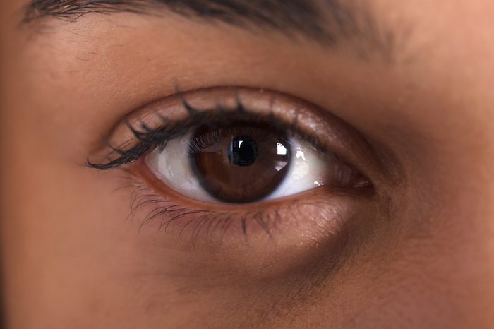 Close-up image of a dark brown eye.