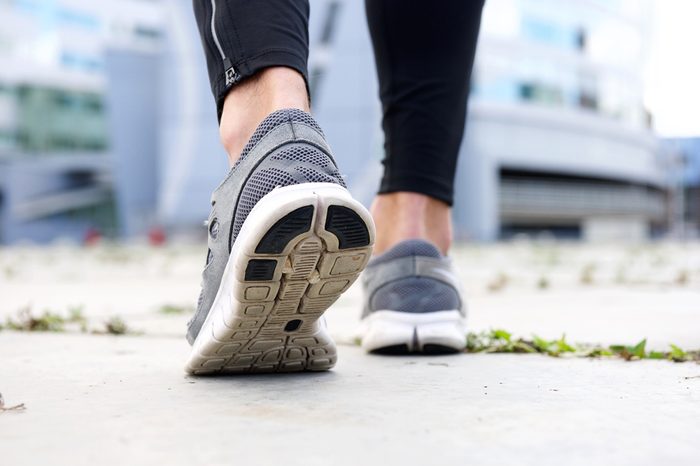 Low angle rear sport shoes walking outside