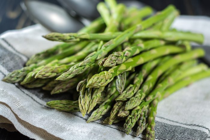 Fresh white and green asparagus on linen napkin