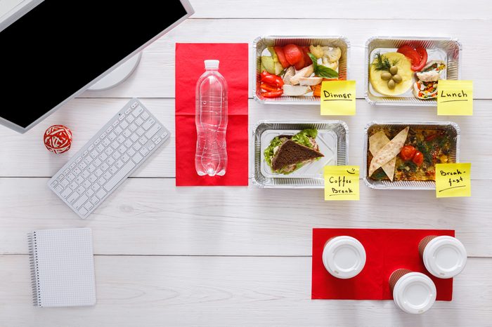 Vegetables, meat and fruits in foil boxes with meal labels