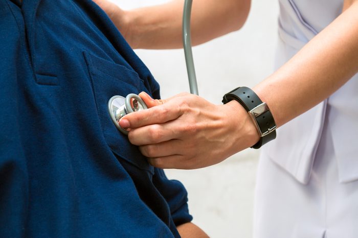 Asian Female doctor listen to elderly patient's heart with Stethoscope