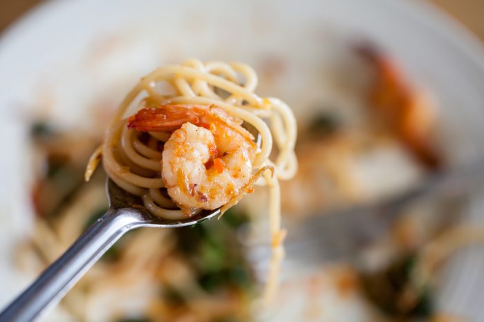 shrimp pasta on fork