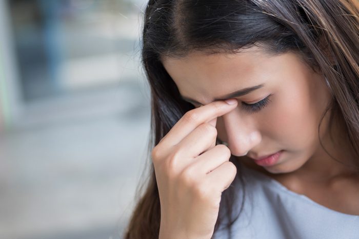 Woman suffering from vertigo and dizziness