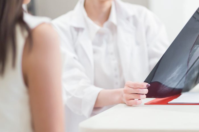 Doctor going over mammogram image with patient