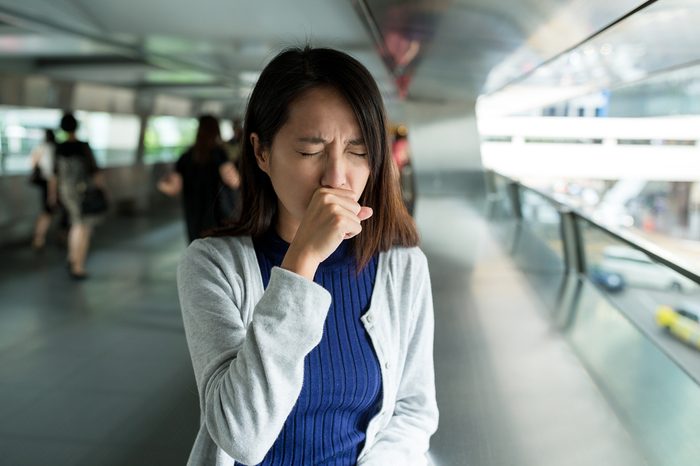 Woman cough at outdoor