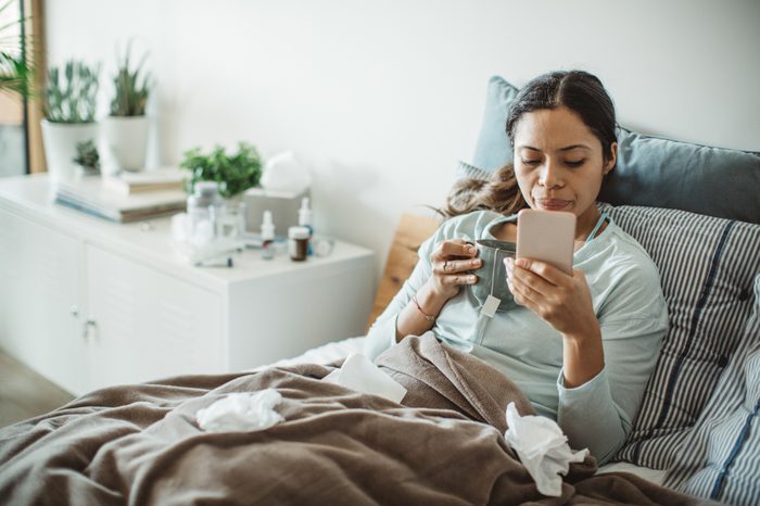 woman in bed sick with a cold