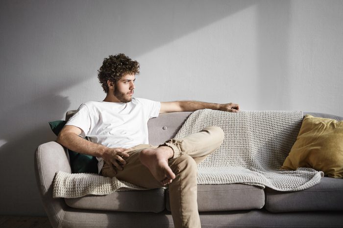 sad man sitting on couch