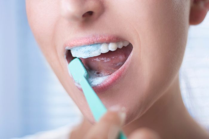 woman Brushing teeth