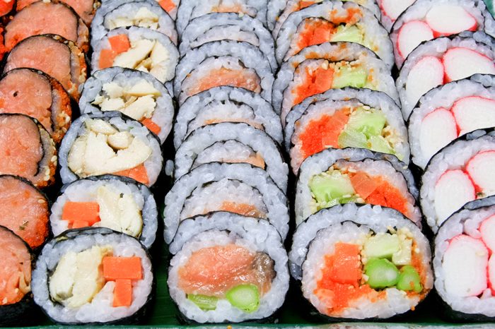 Sushi various fillings are arranged on a plate.