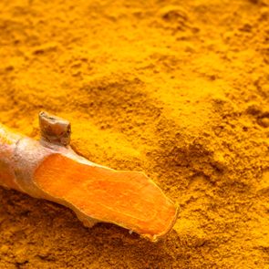 Fresh root and turmeric powder, indian spice, healthy seasoning ingredient for vegan cuisine