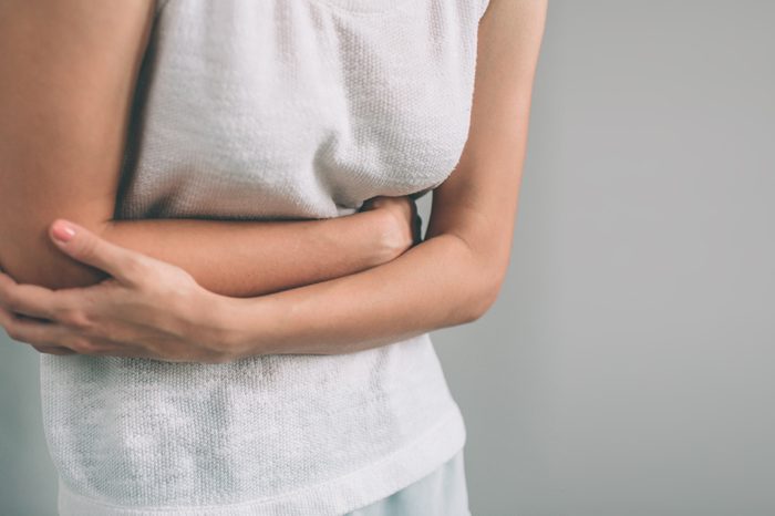 woman bloated holding stomach