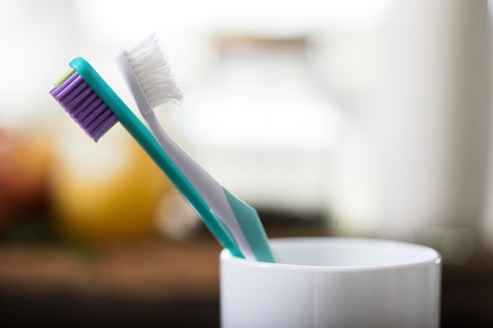 Toothbrushes in glass