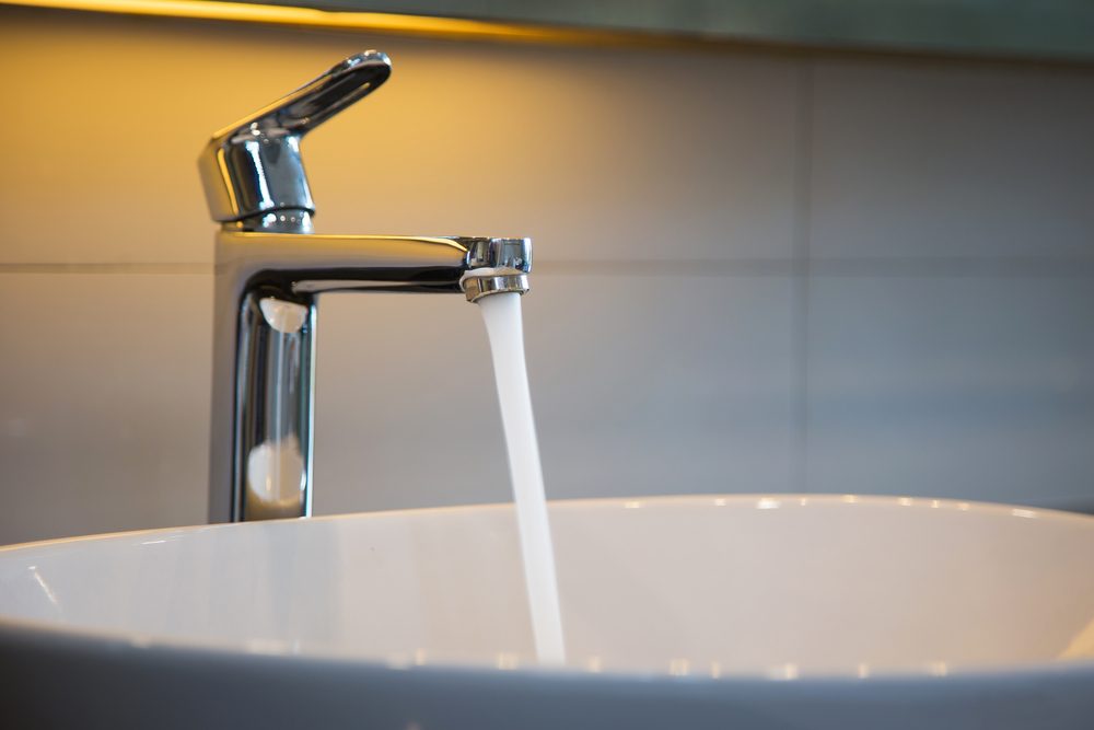 water running from a faucet in a sink