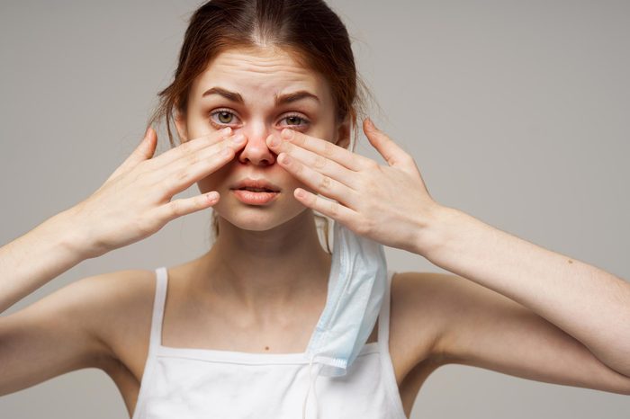 woman rub eye