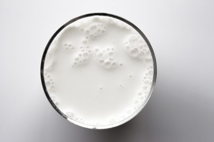 top view of glass milk / Glass of Milk From Above / gray tone