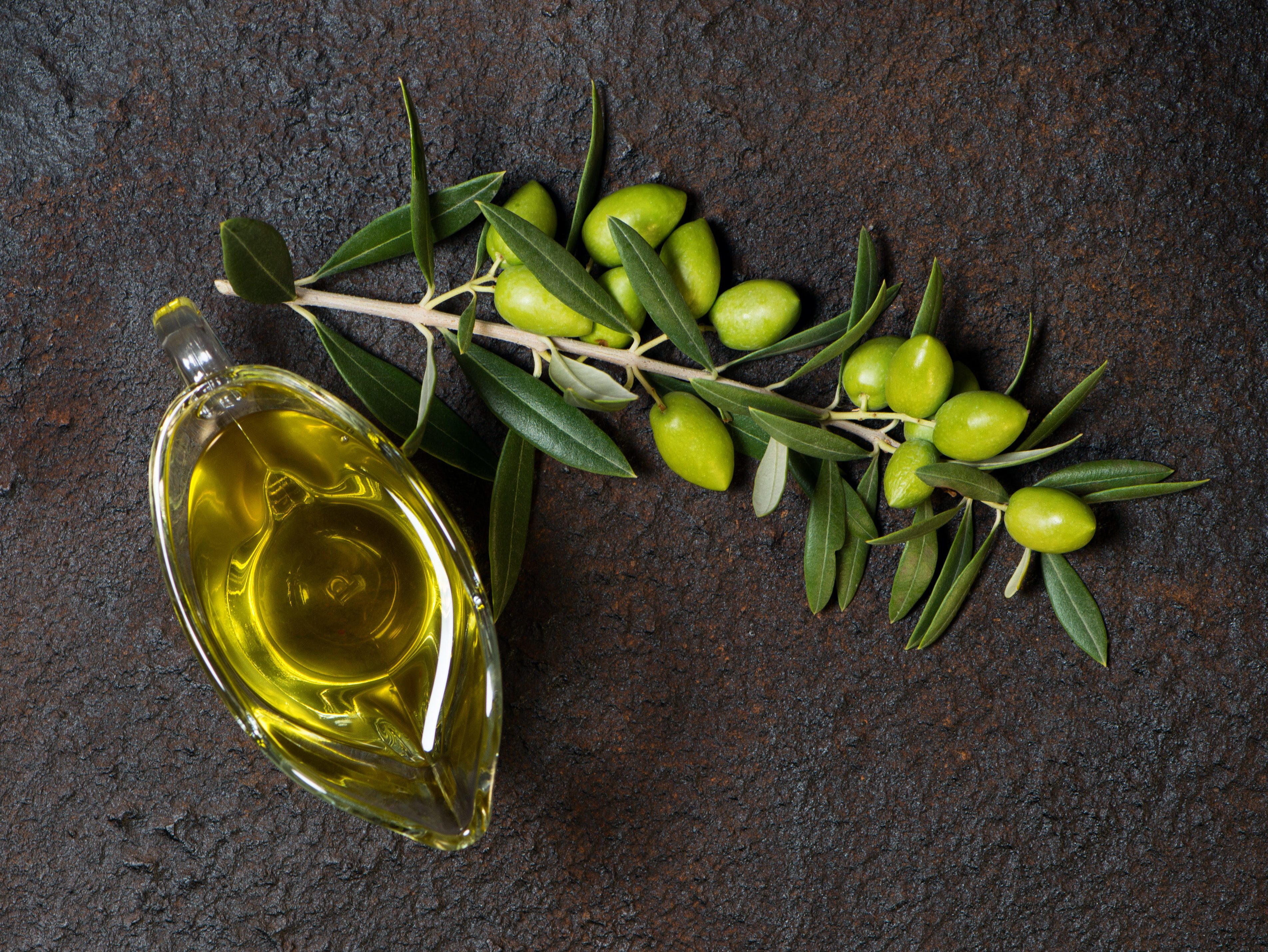 bottle of olive oil and olives