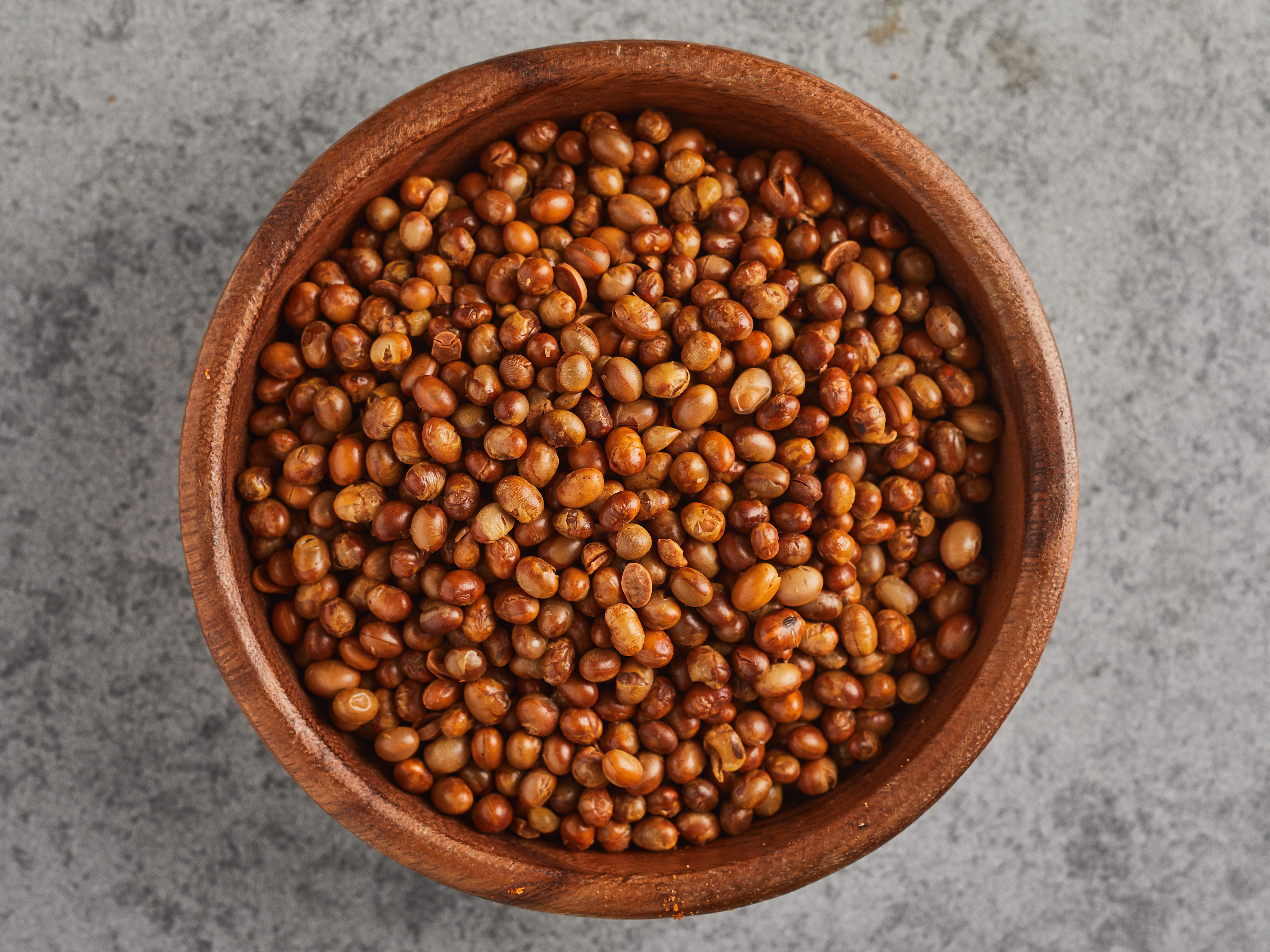 Wooden bowl full of soy beans