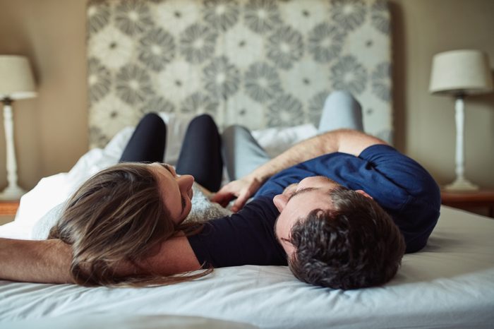 couple in bed talking