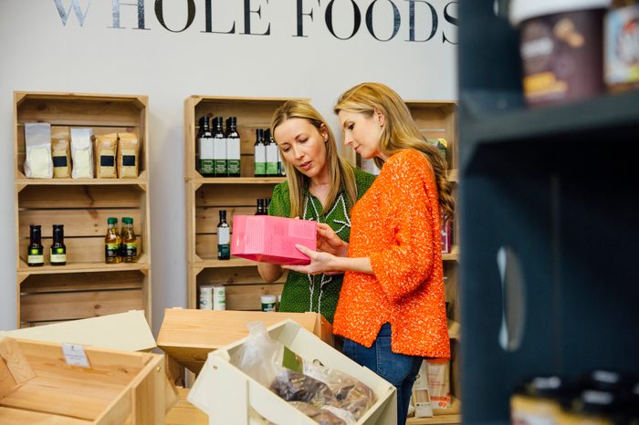 women shopping for food in grocery store